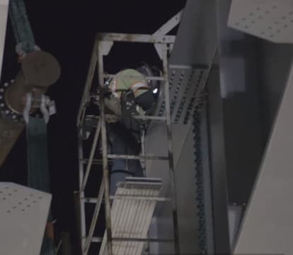 Erection crew install rivets